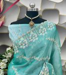 Amazing Turquoise Jimmy Choo Silk Saree With Innovative Blouse Piece